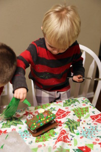 Cam decorating his gingerbread train.